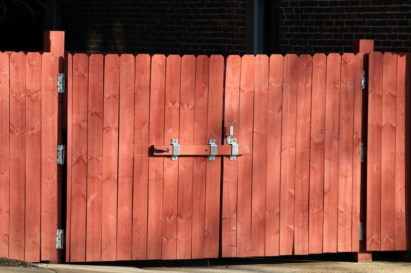 A wooden privacy fence along a residential property line